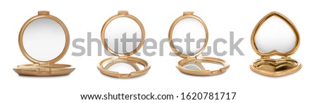 Set of different compact mirrors on white background