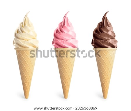 Set of different delicious soft serve ice creams in crispy cones on white background