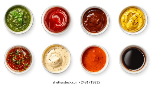 Set of different dip sauces top view. Bowls of many dipping sauces isolated on white background. pesto, ketchup, bbq sauce, mustard, marinara sauce, ranch, romesco, soy sauce. Different sauces set.