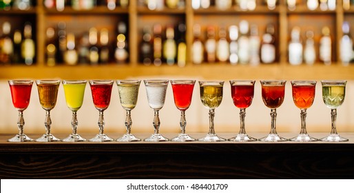 set with different drinks on bar background