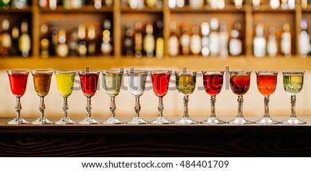 set with different drinks on bar background