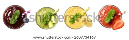 Set of different fruit drinks in glasses isolated on white, top view