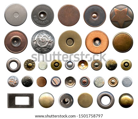 Set of different metal buttons and rivets. Vintage fushion accessories close-up isolated on a white background. Denim culcure modern style. Trousers and jackets elements isolated on white background