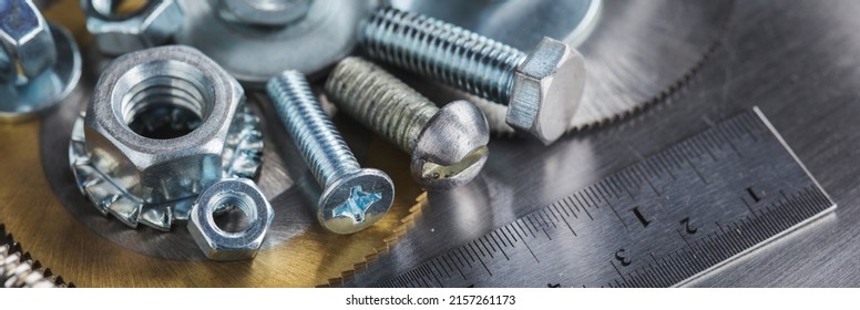 set of different nuts, bolts, screws, washers and drill bits,thread tap and mill cutters on steel plate background. Locksmithing deal. - Shutterstock ID 2157261173