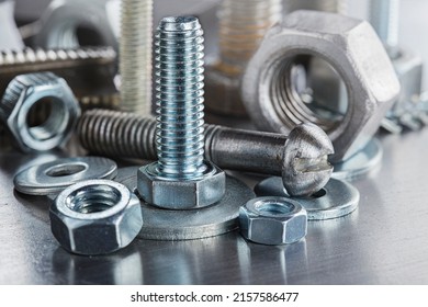 set of different nuts, bolts, screws, washers and drill bits,thread tap and mill cutters on steel plate background. Locksmithing deal. - Shutterstock ID 2157586477