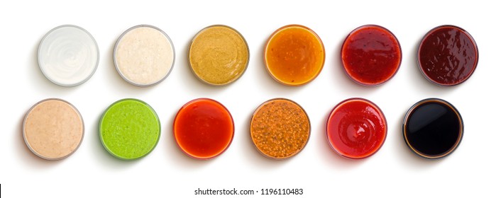 Conjunto de salsas diferentes aisladas en fondo blanco, vista superior
