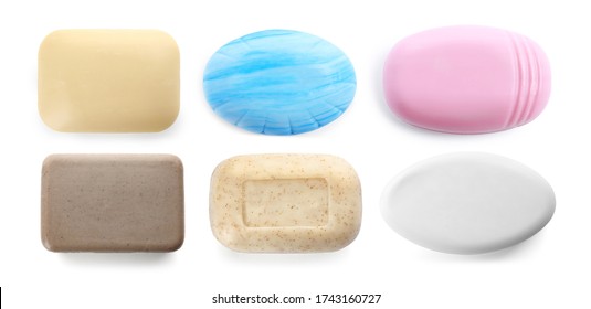 Set of different soap bars on white background, top view