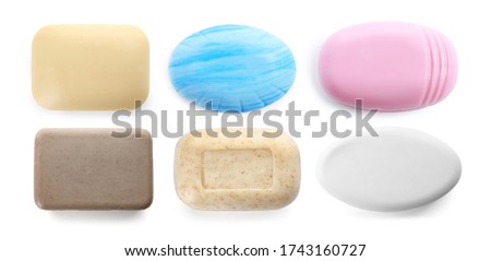 Set of different soap bars on white background, top view