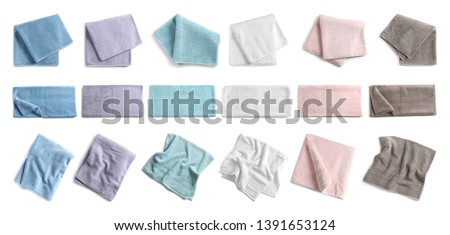 Set of different soft terry towels on white background, top view 