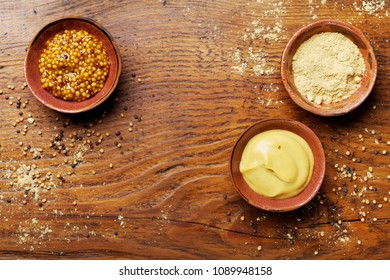 Set Of Different Spices. French Mustard, Dijon Mustard And Powder On Wooden Rustic Table Overhead View.