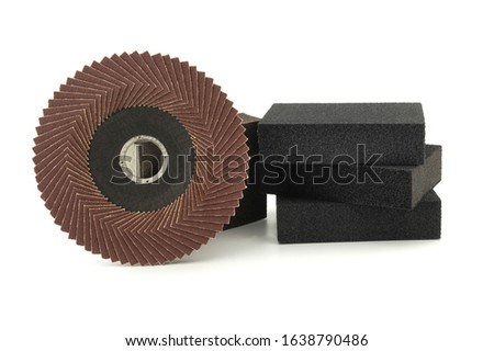 Set of different tools for grinding - flap disc for angle grinder and abrasive sponges , isolated on white background