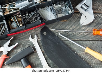 Set of different tools on old wooden background. Selective focus. Top view