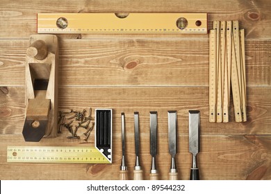 Set of different tools on a wooden planks