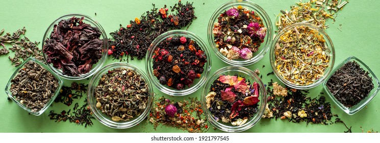 A Set Of Different Types Of Green, Black And Herbal Tea On A Green Background. Delicious Organic Drinks. View From Above. A Place For Text.