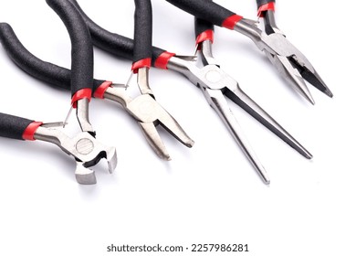 Set of different types of pliers and side cutters isolated on white background. Hand tools for repair, construction and maintenance - Shutterstock ID 2257986281