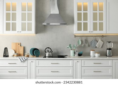 Set of different utensils and dishes on countertop in kitchen - Shutterstock ID 2342230881