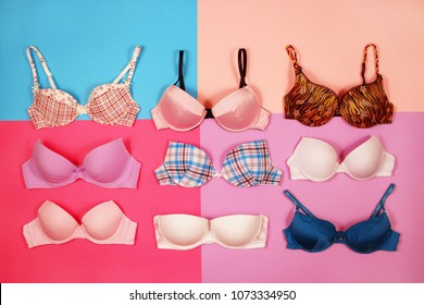 Set of different women's bra on multicolored background