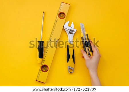 Set of different work tools. Cutter, wrench, measure ruller and a screwdriver.