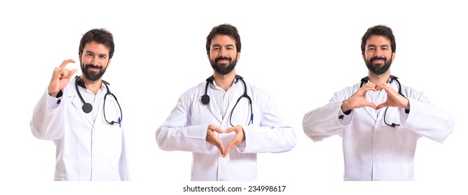 Set Of Doctor Making A Heart With Her Hands Over White Background