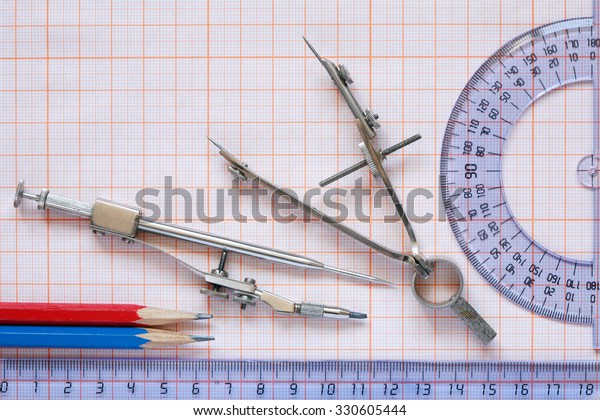 Set of
drawing instrument and rulers on graph
paper