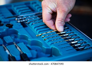 Set of drills for the puncher in a suitcase - Shutterstock ID 470847590