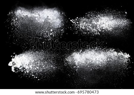 Set of dust powder splash clouds isolated on black background