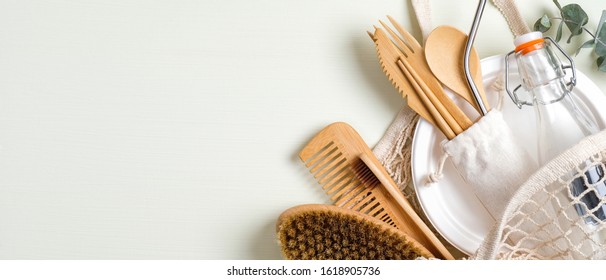 Set Of Eco Friendly Bamboo Cutlery, Mesh Shopping Bag, Massage Brush, Glass Bottle, Bamboo Toothbrush, Wooden Hair Comb. Zero Waste Concept. Sustainable Lifestyle. Eco Store Banner Mockup