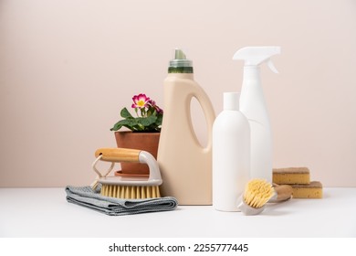 Set of eco-friendly cleaning tools on beige background with plant. Concept of spring cleaning services with copy space - Shutterstock ID 2255777445