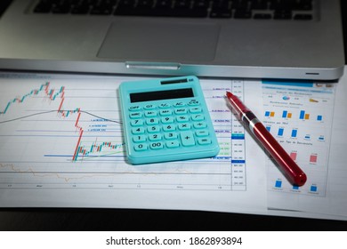 Set Of Economic Scenario, Accounting Desk. Economic Report With Green Calculator And Red Pen On Top.