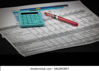 Set Of Economic Scenario, Accounting Desk. Economic Report With Green Calculator And Red Pen On Top.