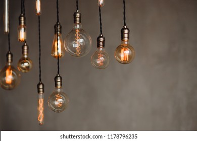Set edison retro lamp on loft gray concrete background. Concept idea - Powered by Shutterstock