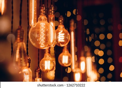 Set edison retro lamp on dark bokeh background of different shapes. - Powered by Shutterstock