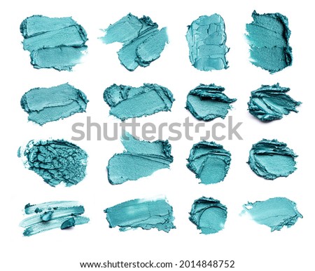 A set of emerald colored strokes, made with eyeliner or acrylic paint, isolated on a white background.