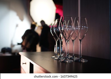 Set of empty transparent glasses on a table at a restaurant party.