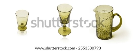 A Set of Empty transparent olive green crystal glass and jar, Vintage glass, cordial glass, tableware, glassware, glass of water on a white background. isolated objec