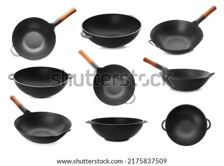 Set with empty woks on white background