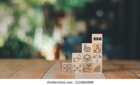 Set Of Environment, Social, And Governance (ESG) Concept. The Wooden Block With Thin Line Icons Such As Sustainable Ecological, Save Water And Energy, Honest People. 