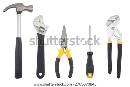 A set of essential hand tools including a claw hammer, adjustable wrench, long-nose pliers, screwdriver, and groove joint pliers arranged on a white background, representing repair work, DIY projects,