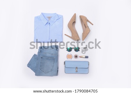 Set of female clothes and accessories ,make up on white background . Flat lay,


