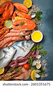 Set of fish, seafood and shellfish. Vertical photo. Top view.