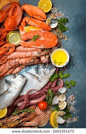 Set of fish, seafood and shellfish. Vertical photo. Top view.