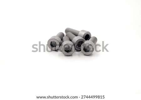 set of five silver colored socket head cap screws or Allen bolts commonly used in motorcycle assembly and customization.