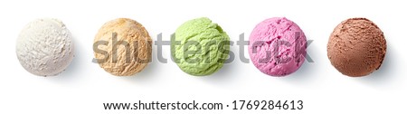 Set of five various ice cream scoops or balls isolated on white background. Top view. Vanilla, strawberry, caramel, pistachio and chocolate flavor