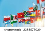 Set of flags fluttering in the wind against blue sky background