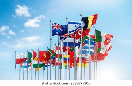 Set of flags fluttering in the wind against blue sky background - Shutterstock ID 2338897205