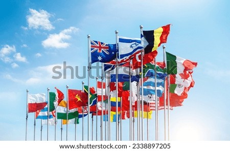 Set of flags fluttering in the wind against blue sky background