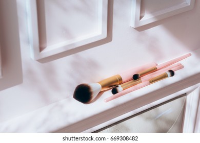 Set Of Flat Top View Of Duo Fiber Brushes For Applying Face Makeup On Pink Background.Fashion, Beauty And Cosmetic Product, Tool Set.Vintage Tone.