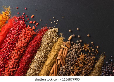 Set of flavors on blackboard background, top view. Spices for cooking tasty food. - Shutterstock ID 1136879900