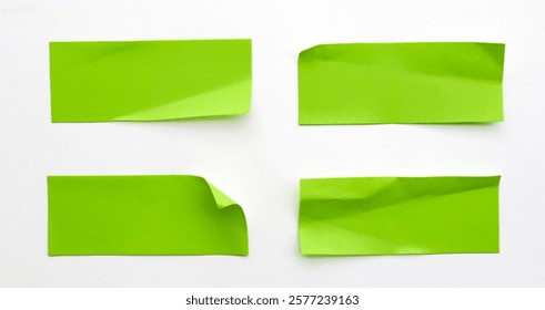 A set of fluorescent green rectangular paper sticker label isolated on white background. 