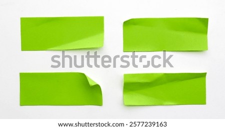 A set of fluorescent green rectangular paper sticker label isolated on white background. 